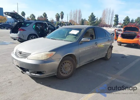 2003 Toyota Camry Le z USA, uszkodzony, nr VIN JTDBE32K730226826